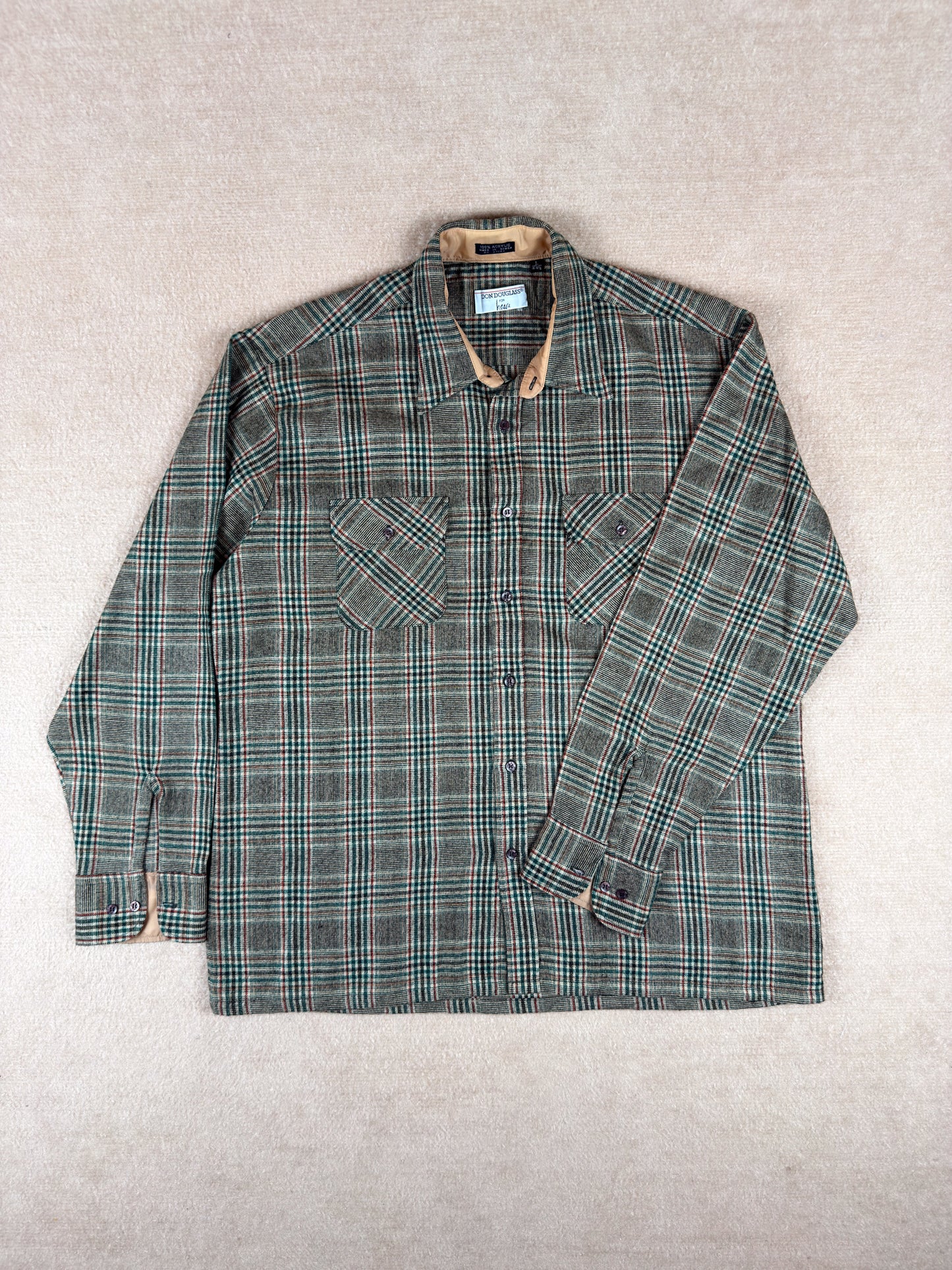 Plaid shirt with a collar on a light gray background